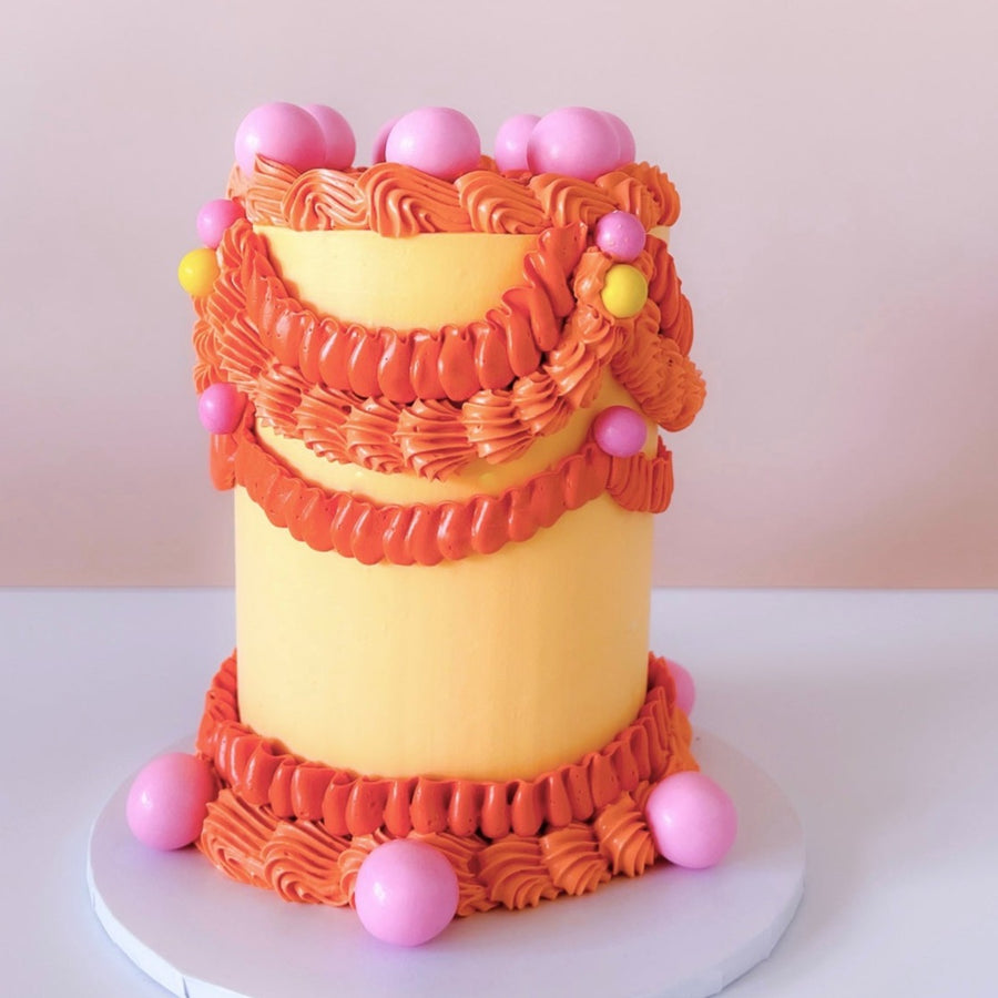 Buttercream decorated cake lambeth style with Colour Mill Sunset and Yellow Oil Blend 